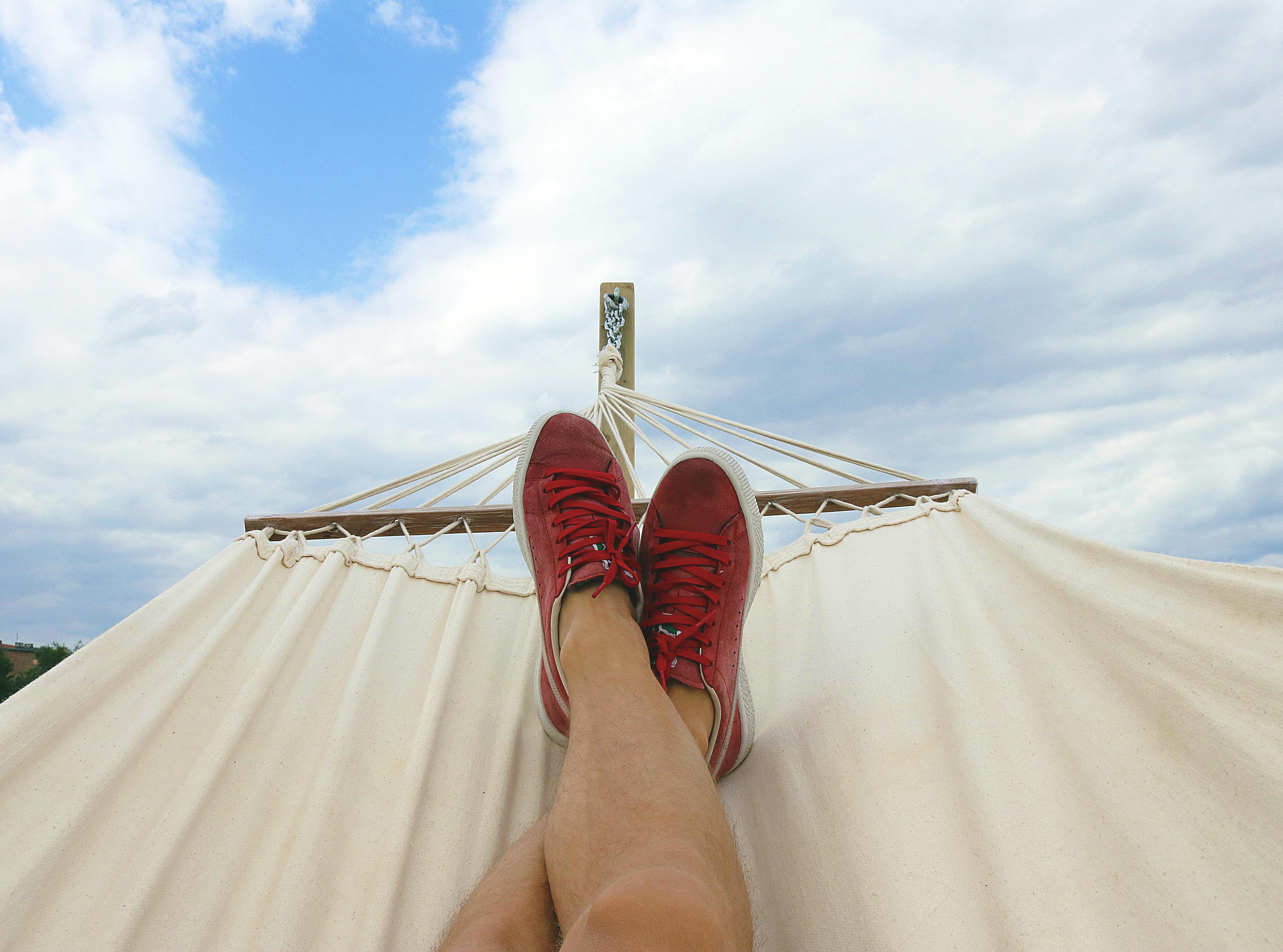 Quiet hammock at sunset overlooking calm water.